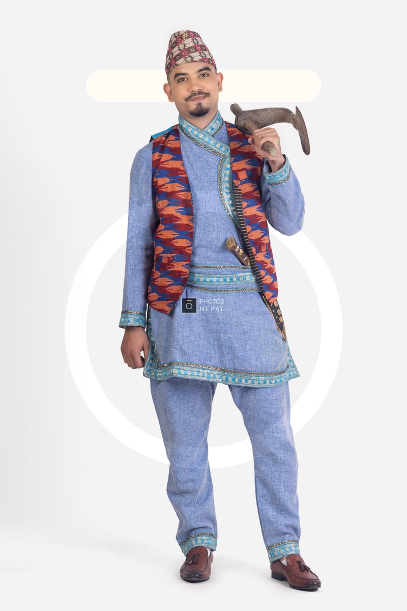 A Excited Young Guy Holding Kodalo While Wearing Traditional Nepali a-excited-young-guy-holding-kodalo-while-wearing-traditional-nepali