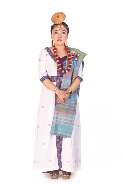 A serious tall Limbu woman with cultural costumes and jewelry standing ...