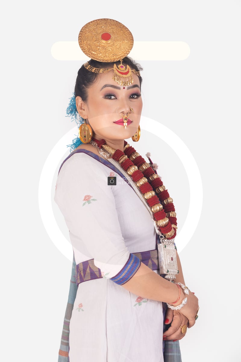 Adorable Limbu woman posing sideways for the camera in a traditional ...