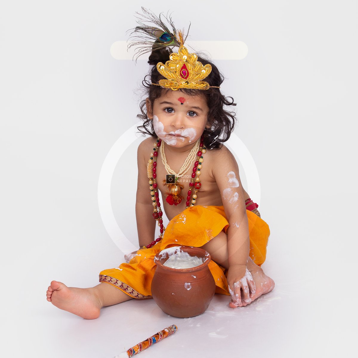 Cute Hindu child dressed as Lord Krishna enjoying yogurt - Royalty ...