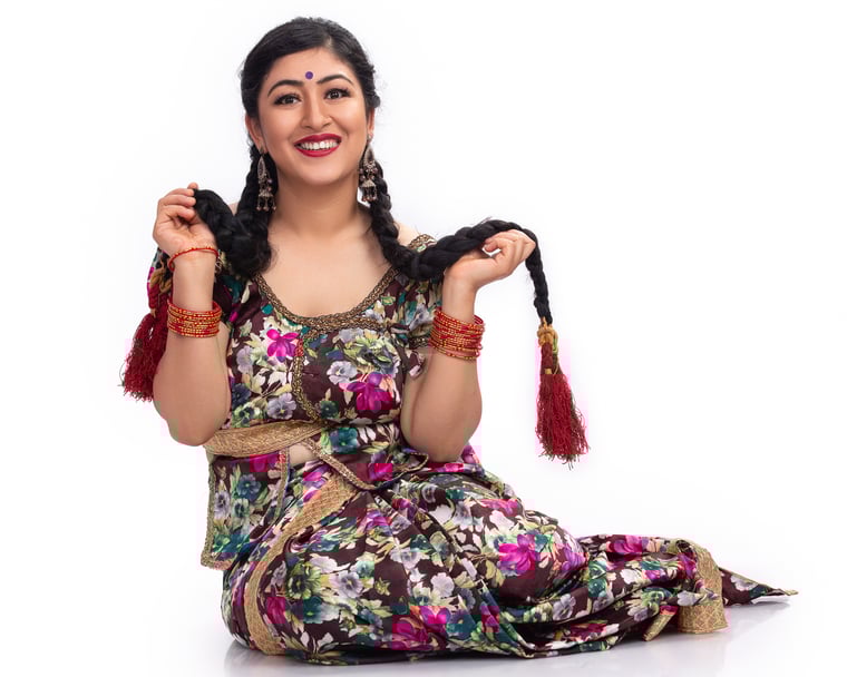 Nepali Beauty in Traditional Dhoti and Choli Sitting Comfortably