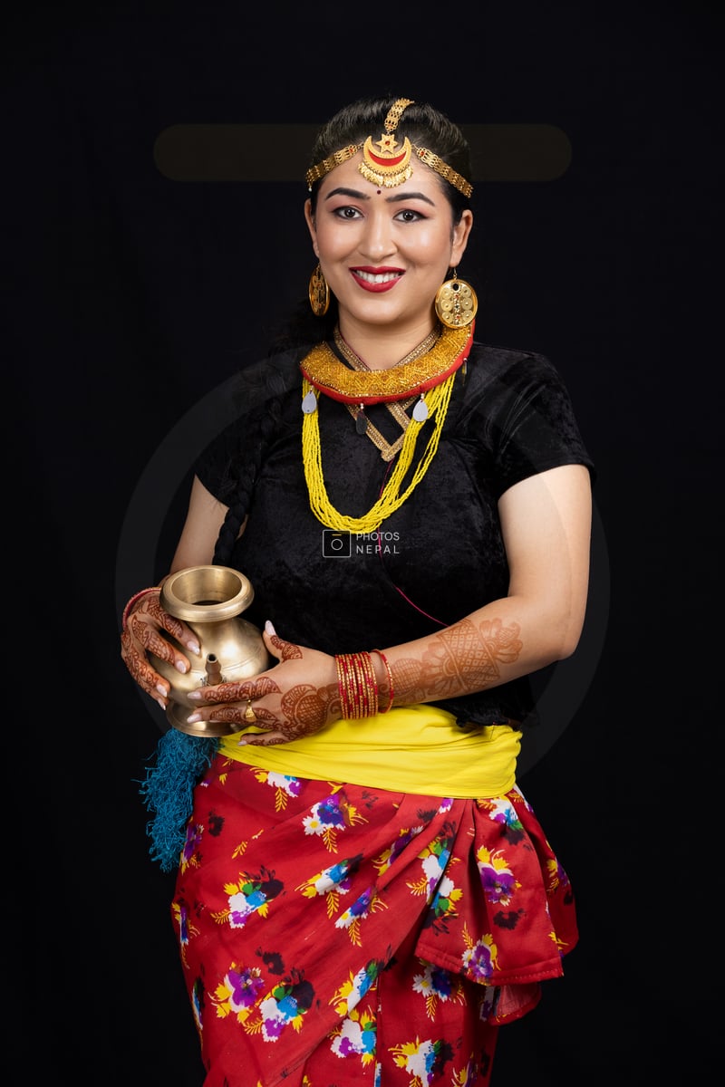 Nepali Girl Holding Karuwa in Traditional Attire Photos Nepal Nepali Girl Holding Karuwa in Traditional Attire Photos Nepal