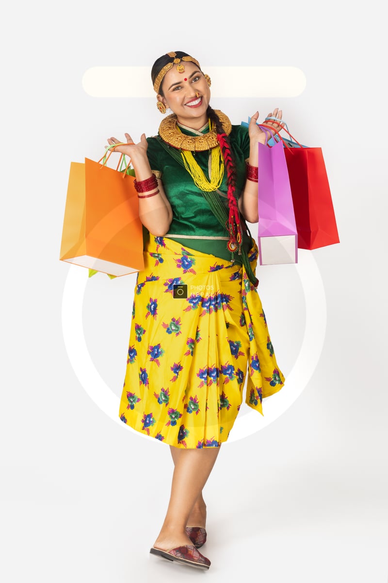 Gunyo Nepali girl in traditional Gunyo Choli dress and accessories holding ...
