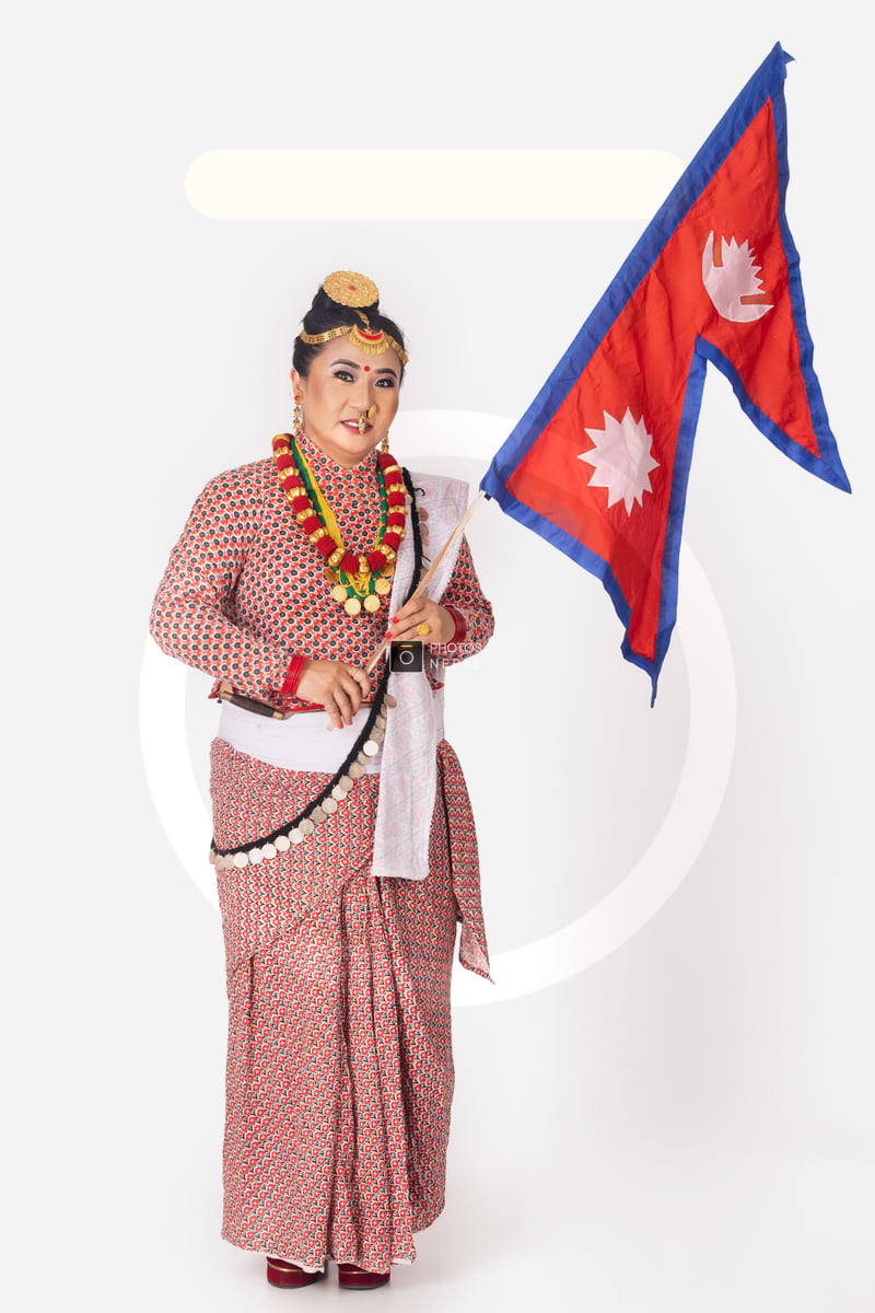 Kirati Rai Proud Kirat Rai woman holding the National flag of Nepal - Photos Nepal