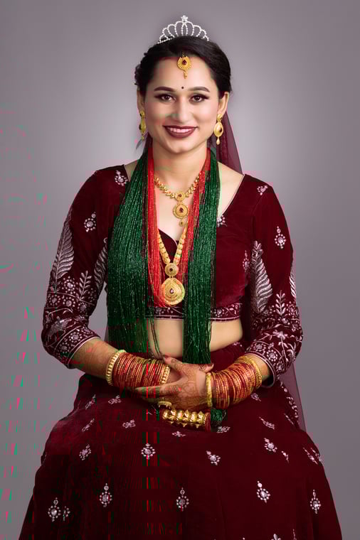 A Beautiful Nepalese Bride wearing a dark Red lehenga Photos Nepal