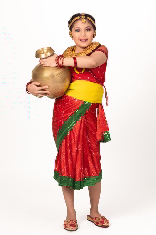 A Girl carrying a water pot Photos Nepal