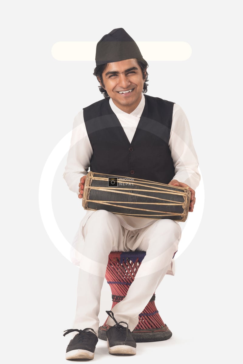 A Guy playing Madal - Photos Nepal